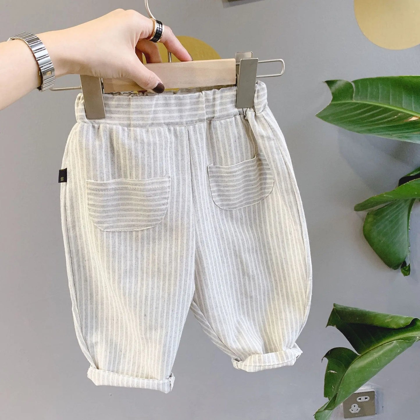 BabyLove Bubebaby Unisex cotton harem pants for children aged 4-6 years. Featuring a striped pattern, elastic waist, and pockets, these regular-fit pants are perfect for all seasons. True to size with a mid-waist design, offering comfort and style for any occasion