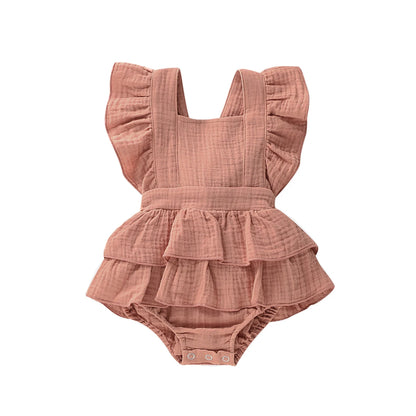 BabyLove Ruffled Jumpsuit at BubeBaby, perfect for baby girls aged 0-18 months. Made from soft cotton and polyester, this fashionable romper features a stylish O-neck and ruffled design.  it's ideal for spring and autumn