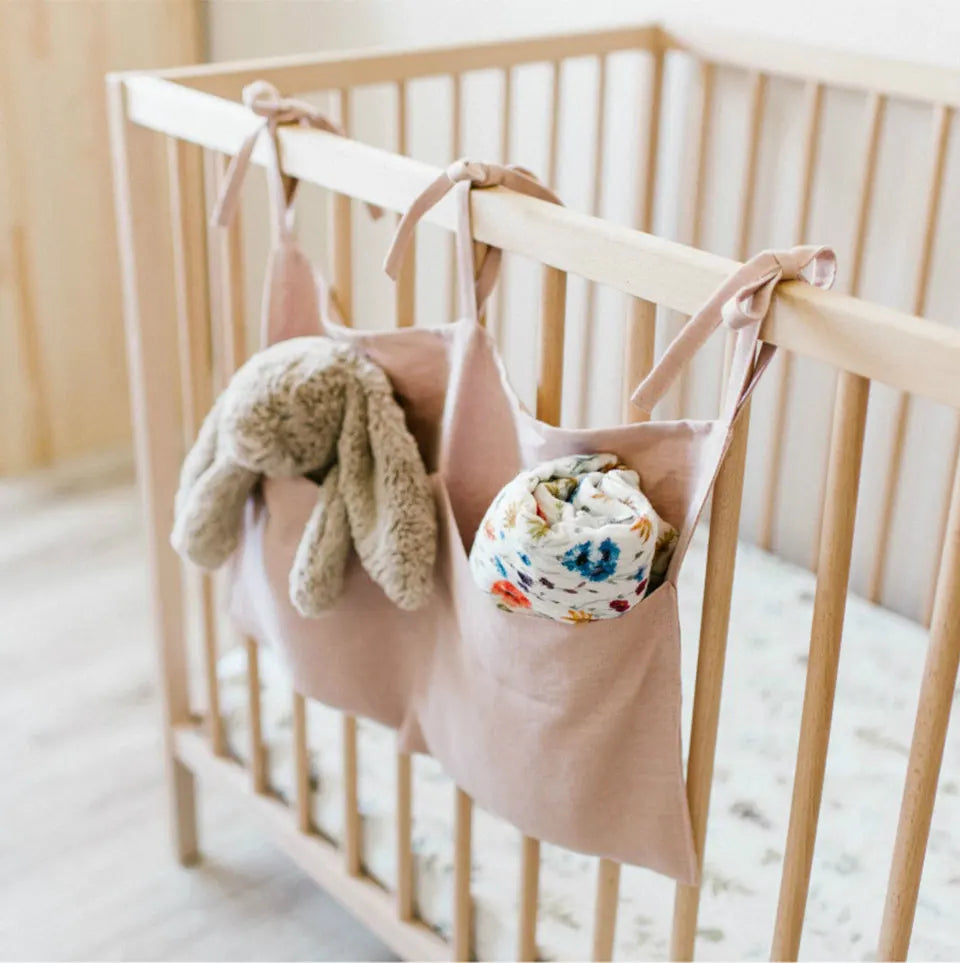 Discover BubeBaby's Nursery Crib Organizer, perfect for babies aged 0-1Y. Available in unisex colors (gray, pink, beige, navy blue), this versatile organizer comes in two styles: Canvas (29x49cm) and Muslin (20x39cm). Made from durable linen and ideal for year-round use, it keeps your nursery tidy and stylish