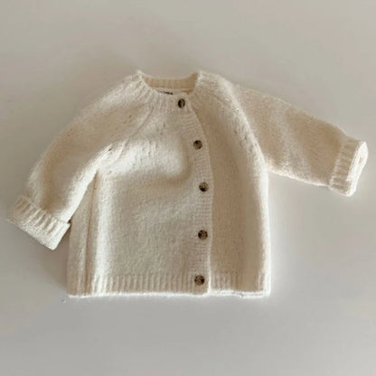 BabyLove Knitted cardigan for baby girls in a blend of cotton and wool. Features O-neck, button closure, and full-length sleeves. Available in sizes 0-4 years. Solid pattern, suitable for spring, autumn, and winter. Soft, warm woolen fabric