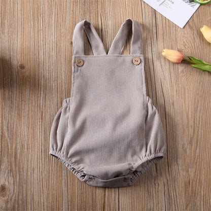 BabyLove Corduroy Unisex Romper - Soft, brown corduroy fabric with long sleeves, button-down front, and a cozy fit. Perfect for infants and toddlers. Gender-neutral design