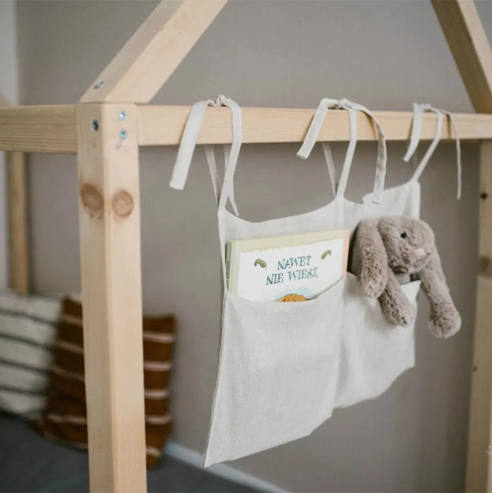 Discover BubeBaby's Nursery Crib Organizer, perfect for babies aged 0-1Y. Available in unisex colors (gray, pink, beige, navy blue), this versatile organizer comes in two styles: Canvas (29x49cm) and Muslin (20x39cm). Made from durable linen and ideal for year-round use, it keeps your nursery tidy and stylish