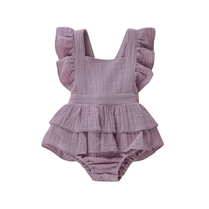 BabyLove Ruffled Jumpsuit at BubeBaby, perfect for baby girls aged 0-18 months. Made from soft cotton and polyester, this fashionable romper features a stylish O-neck and ruffled design.  it's ideal for spring and autumn