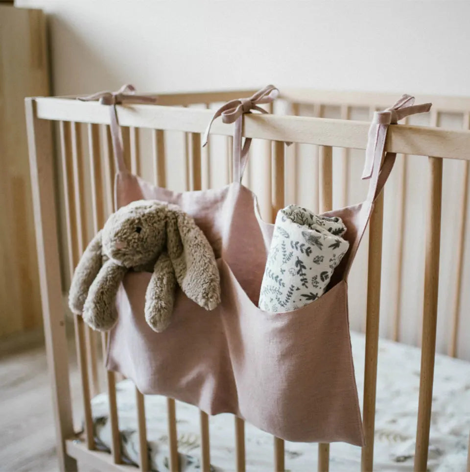 Discover BubeBaby's Nursery Crib Organizer, perfect for babies aged 0-1Y. Available in unisex colors (gray, pink, beige, navy blue), this versatile organizer comes in two styles: Canvas (29x49cm) and Muslin (20x39cm). Made from durable linen and ideal for year-round use, it keeps your nursery tidy and stylish