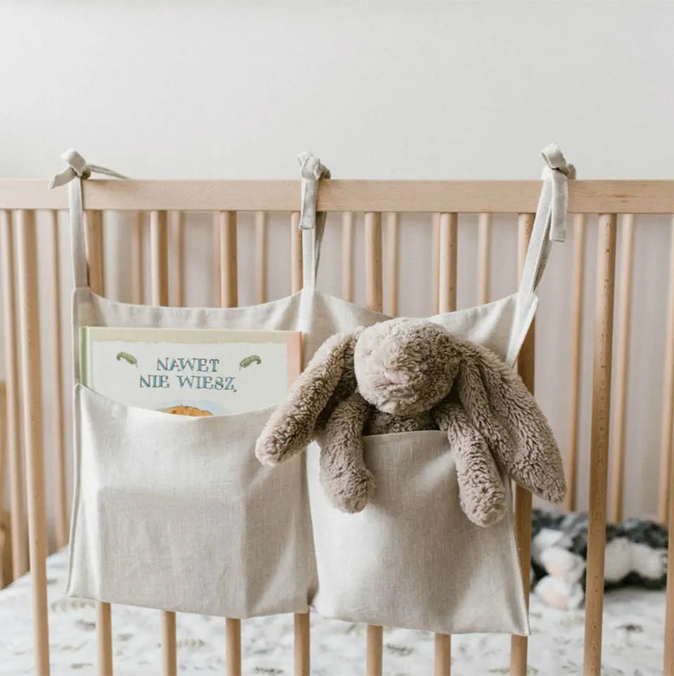 Discover BubeBaby's Nursery Crib Organizer, perfect for babies aged 0-1Y. Available in unisex colors (gray, pink, beige, navy blue), this versatile organizer comes in two styles: Canvas (29x49cm) and Muslin (20x39cm). Made from durable linen and ideal for year-round use, it keeps your nursery tidy and stylish