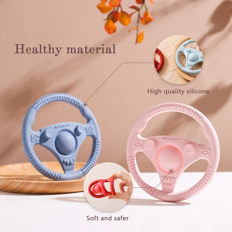 Silicone Bubebaby BabyLove Teething Toy Car Wheel – A fun and safe teether for babies, designed as an analog steering wheel. Made from 100% silicone, it's latex, nitrosamine, phthalate, BPA, and PVC free. Suitable for infants from 0 to 36 months. Available in various colors and comes in single packaging