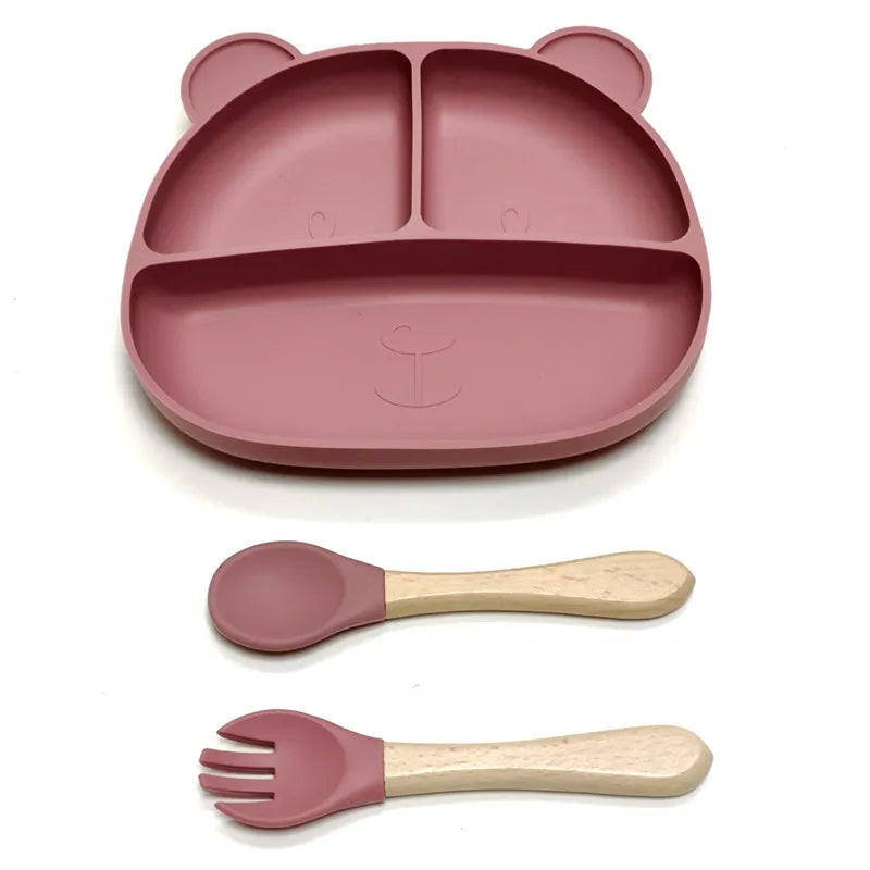 the BabyLove Silicone Dinner Plate with Cutlery at BubeBaby. Made from BPA-free silicone and CE certified, this dinnerware set is perfect for children aged 0-6 years. Featuring a solid pattern and multi-color options, it's designed for easy cleaning and safe feeding. Ideal for infants and toddlers