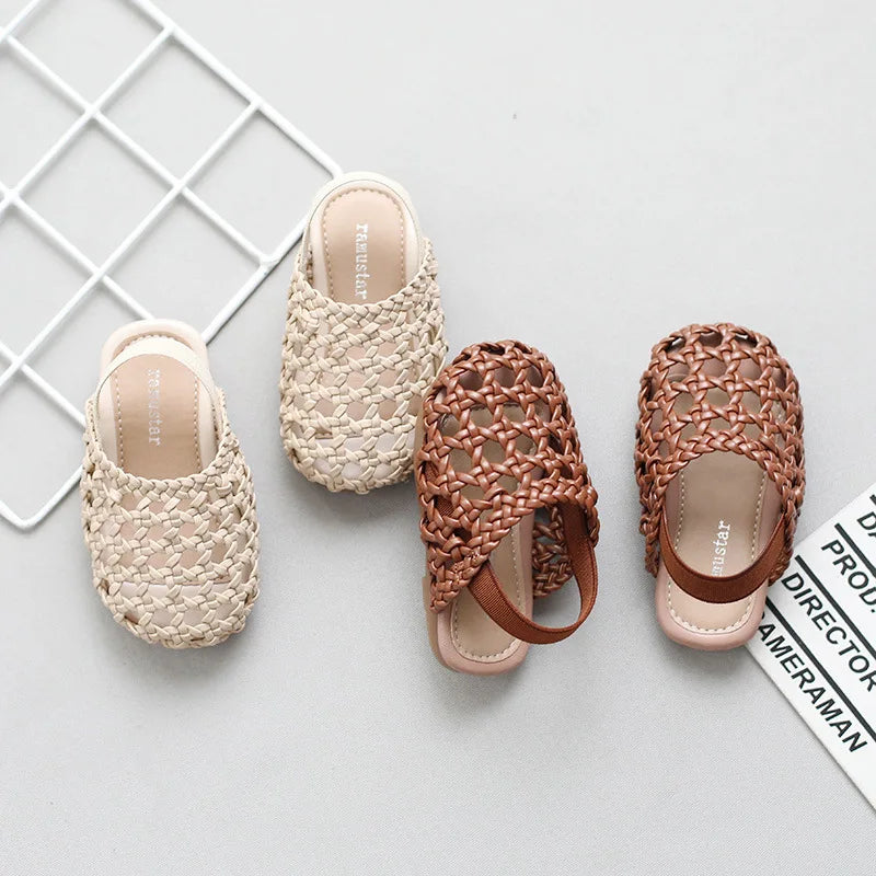 Shop BabyLove Woven Slip-On Sandals for girls at BubeBaby. These summer sandals feature soft faux leather, quick-dry fabric, and a flat heel with cut-out decorations. Available in sizes 15-25, they fit true to size and offer a comfortable, elastic band closure. Perfect for warm weather and stylish play