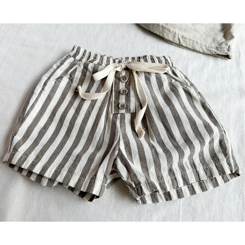 Shop our BabyLove Vintage Striped Shorts at BubeBaby. Perfect for summer, these unisex shorts feature a European and American style with a solid pattern. Made from soft cotton, they fit true to size and come in sizes ranging from 6-12m to 4-5T. Available in coffee, green, and beige. Ideal for ages 0-6 years