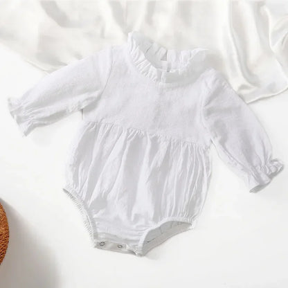 Bubebaby BabyLove Cotton Ruffled Long Sleeve buttoned Romper.  A cute and cozy baby romper made from soft cotton fabric, featuring long sleeves, a ruffled collar and wrists, with a snap closure for easy dressing. 