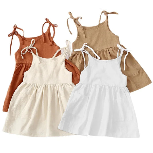 A BabyLove by Bubebaby light and breezy summer dress with spaghetti straps, designed for babies. The dress features a loose, relaxed fit and a soft, comfortable fabric, perfect for keeping little ones cool on warm days