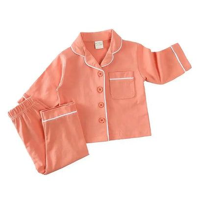 Discover our luxurious unisex cotton pajamas for kids aged 12 Mo- 5 Years at Bubebaby. Perfect for autumn, these solid-colored pajamas feature a classic turn-down collar and regular sleeves, offering comfort and style for your little ones