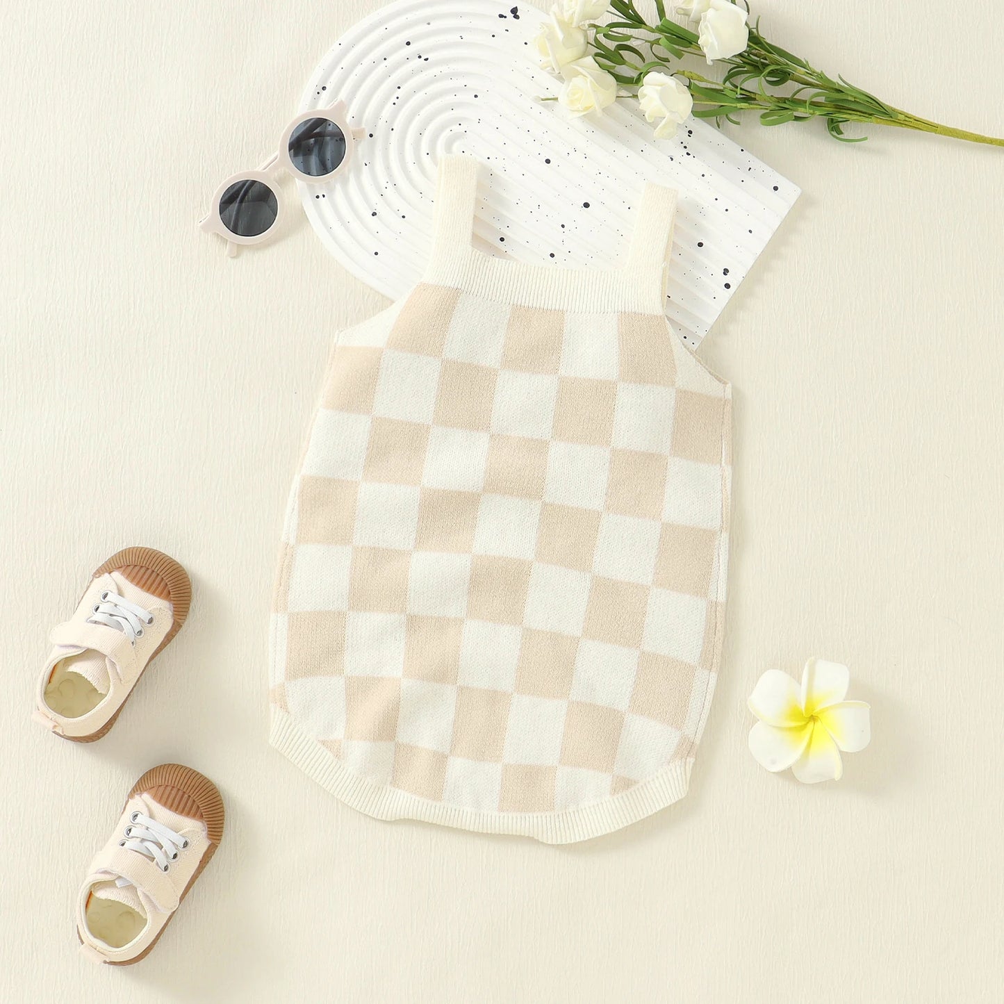 Bubebaby BabyLove unisex romper in a comfortable cotton and polyester blend, featuring a charming plaid pattern, square-neck collar, and covered button closures. Ideal for summer, available in sizes for ages 0-24 months.