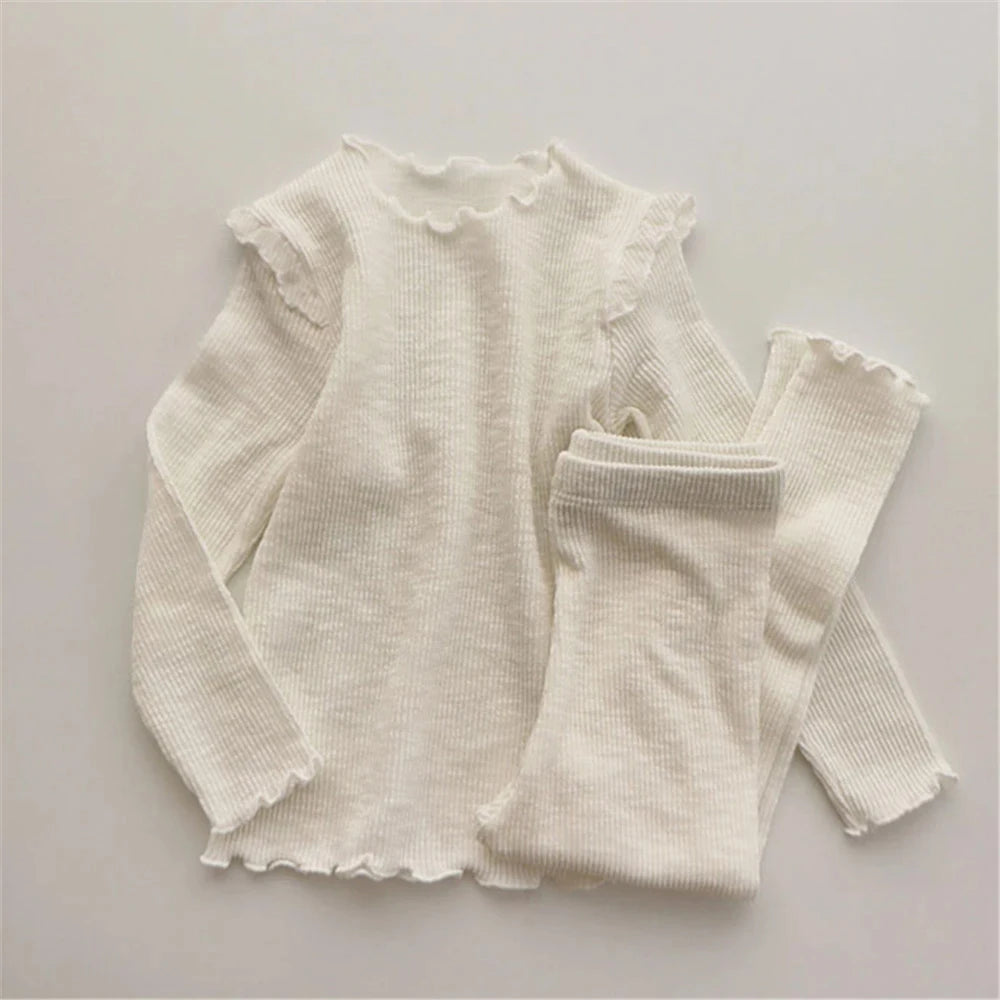 Shop the Babylove Spring Sleepwear Set at BubeBaby, featuring cozy cotton pajamas perfect for spring and autumn. Available for ages 7-12 months to 4-6 years, this unisex set includes a round-neck top and pants with a casual, printed design. Fits true to size with full sleeves and broadcloth fabric. Ideal for comfortable, stylish sleepwear