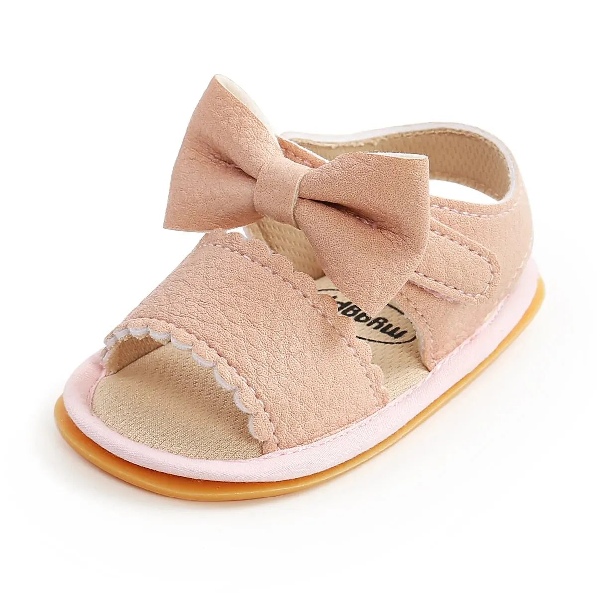 A cute pair of Bubebaby BabyLove  faux leather sandals for infants featuring an adorable bow detail. The sandals are designed for comfort and style, perfect for little ones to wear during warm weather. The adjustable strap ensures a secure fit while the soft sole provides cushioning for tiny feet