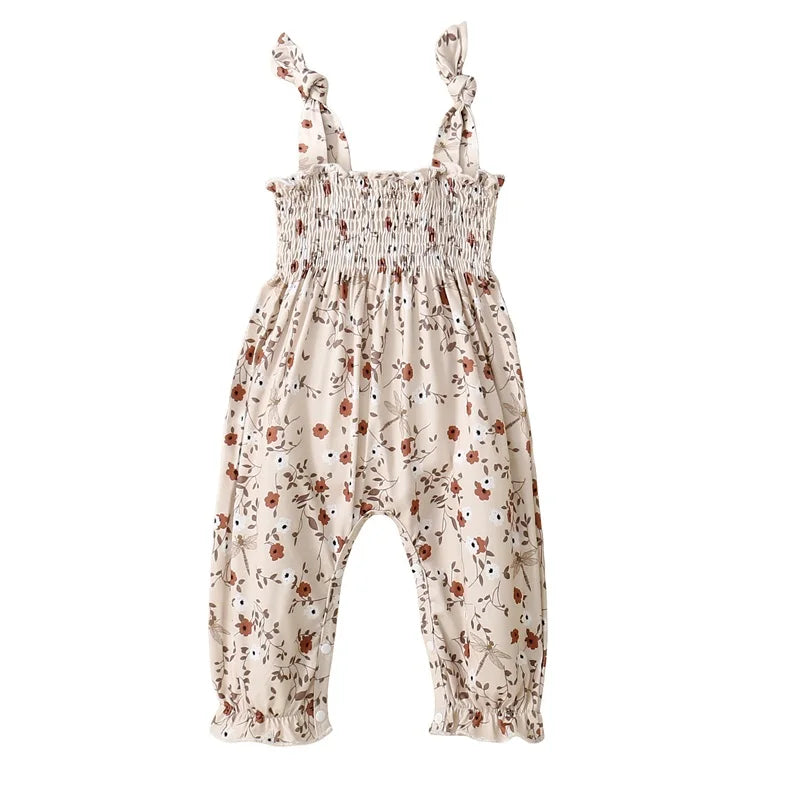 Bubebaby BabyLove Floral Jumpsuit Romper. The romper features a floral pattern with a mix of tranquil colors. Featuring an elasticized chest with shoulder straps, and snap closures at the bottom for easy diaper changes.