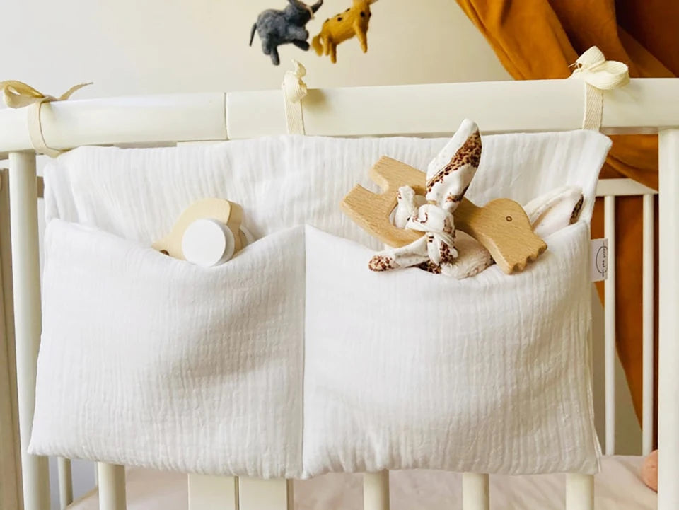 Discover BubeBaby's Nursery Crib Organizer, perfect for babies aged 0-1Y. Available in unisex colors (gray, pink, beige, navy blue), this versatile organizer comes in two styles: Canvas (29x49cm) and Muslin (20x39cm). Made from durable linen and ideal for year-round use, it keeps your nursery tidy and stylish