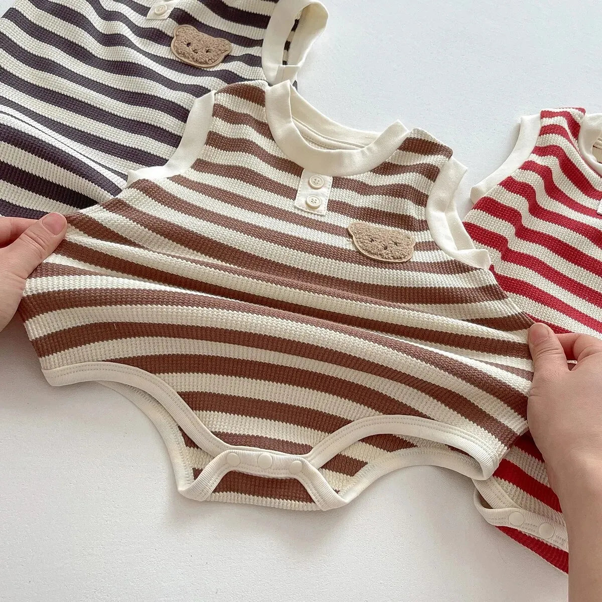 Keep your baby stylish and comfy with our BabyLove Striped Summer Sleeveless Romper From Bubebaby. Made from 95% cotton, this pullover romper features a breathable, sleeveless design perfect for hot days. Available in sizes for 0-24 months, it's ideal for keeping little ones cool and free to explore. Shop now for the perfect summer outfit