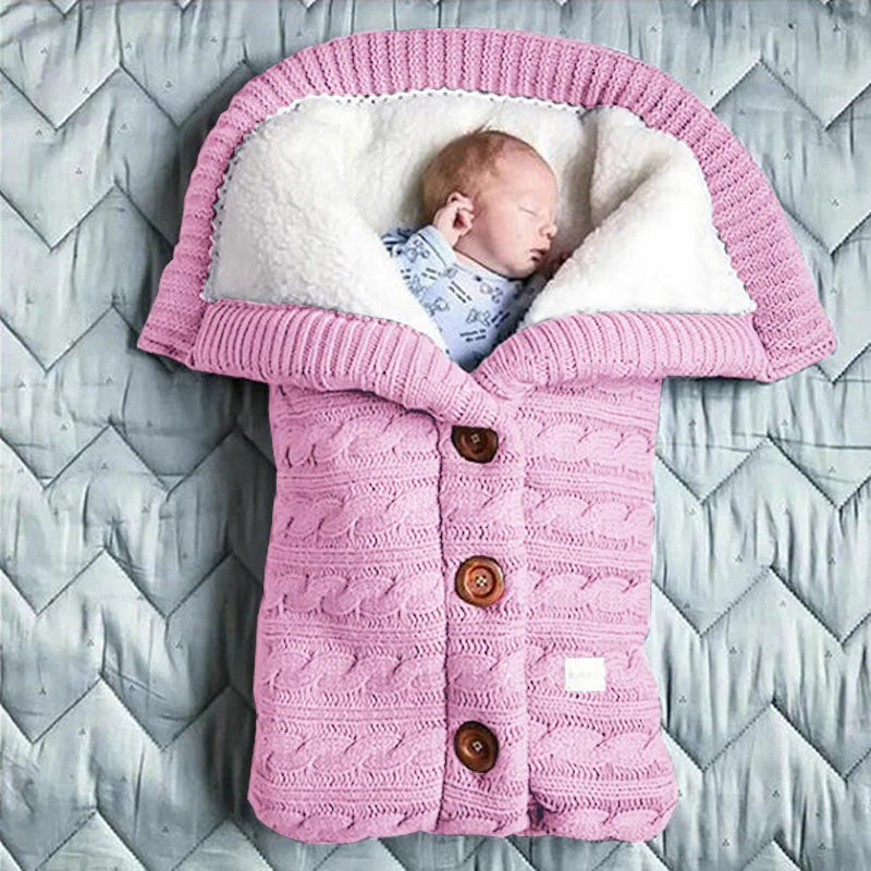 Nursery Knitted Sleeping Bag Cover at BubeBaby, designed for babies 0-12 months. Made from cozy wool and nylon, this unisex sleep sack is perfect for winter. Features include a solid pattern, knitted linen flower color, and measures 68x40 cm. Lightweight at 420g and packaged in a 40x32x3 cm box