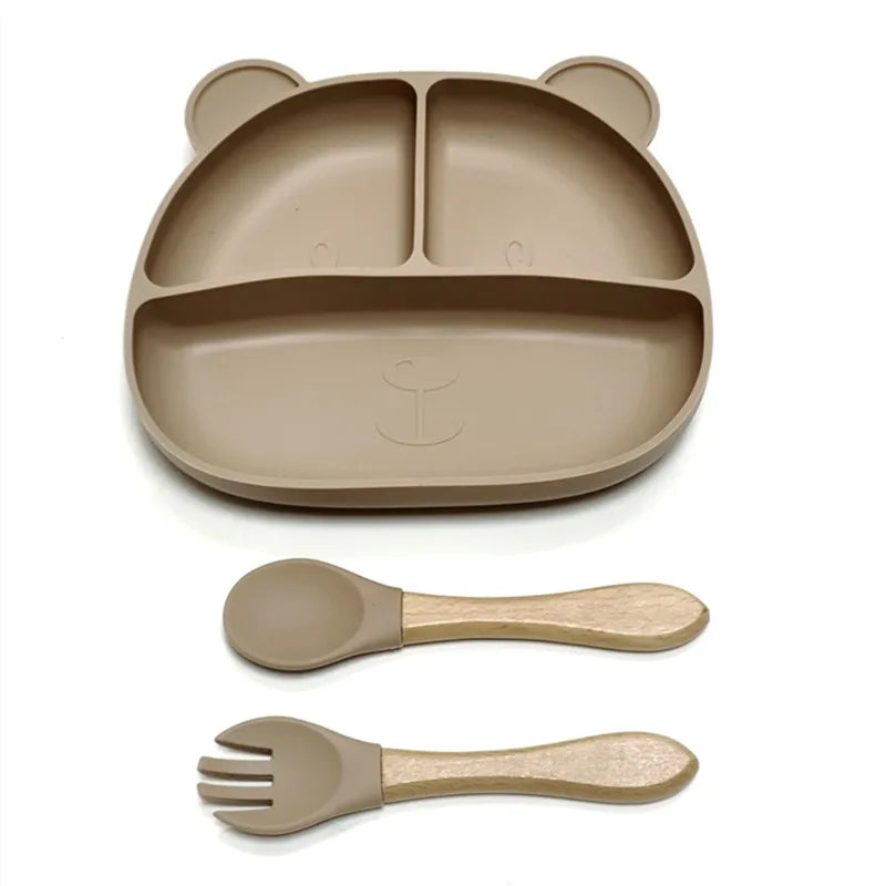 the BabyLove Silicone Dinner Plate with Cutlery at BubeBaby. Made from BPA-free silicone and CE certified, this dinnerware set is perfect for children aged 0-6 years. Featuring a solid pattern and multi-color options, it's designed for easy cleaning and safe feeding. Ideal for infants and toddlers