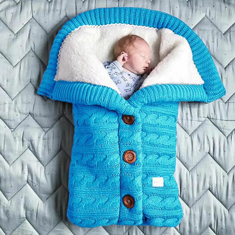 Nursery Knitted Sleeping Bag Cover at BubeBaby, designed for babies 0-12 months. Made from cozy wool and nylon, this unisex sleep sack is perfect for winter. Features include a solid pattern, knitted linen flower color, and measures 68x40 cm. Lightweight at 420g and packaged in a 40x32x3 cm box