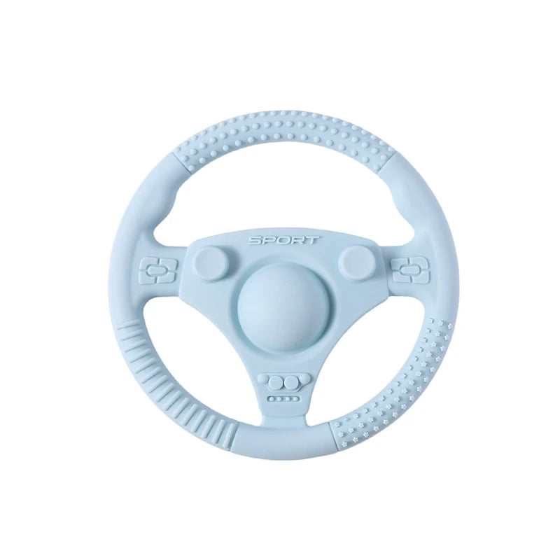 Silicone Bubebaby BabyLove Teething Toy Car Wheel – A fun and safe teether for babies, designed as an analog steering wheel. Made from 100% silicone, it's latex, nitrosamine, phthalate, BPA, and PVC free. Suitable for infants from 0 to 36 months. Available in various colors and comes in single packaging