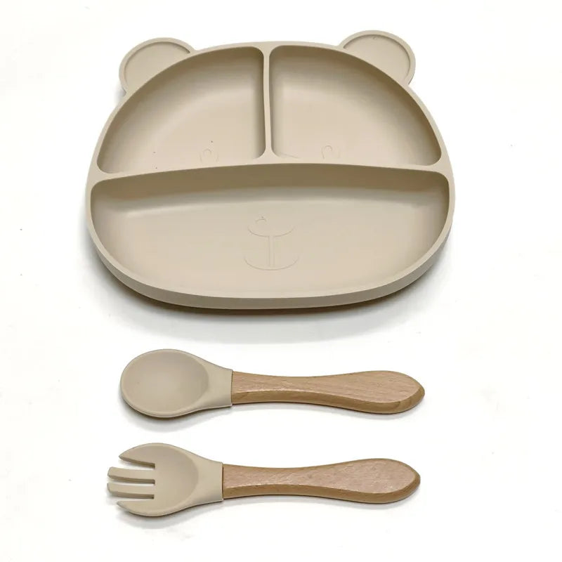 the BabyLove Silicone Dinner Plate with Cutlery at BubeBaby. Made from BPA-free silicone and CE certified, this dinnerware set is perfect for children aged 0-6 years. Featuring a solid pattern and multi-color options, it's designed for easy cleaning and safe feeding. Ideal for infants and toddlers