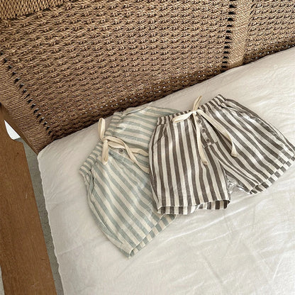 Shop our BabyLove Vintage Striped Shorts at BubeBaby. Perfect for summer, these unisex shorts feature a European and American style with a solid pattern. Made from soft cotton, they fit true to size and come in sizes ranging from 6-12m to 4-5T. Available in coffee, green, and beige. Ideal for ages 0-6 years