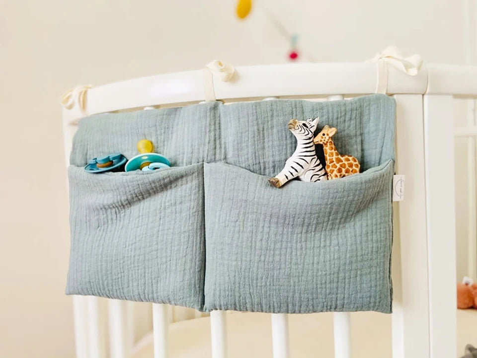 Discover BubeBaby's Nursery Crib Organizer, perfect for babies aged 0-1Y. Available in unisex colors (gray, pink, beige, navy blue), this versatile organizer comes in two styles: Canvas (29x49cm) and Muslin (20x39cm). Made from durable linen and ideal for year-round use, it keeps your nursery tidy and stylish