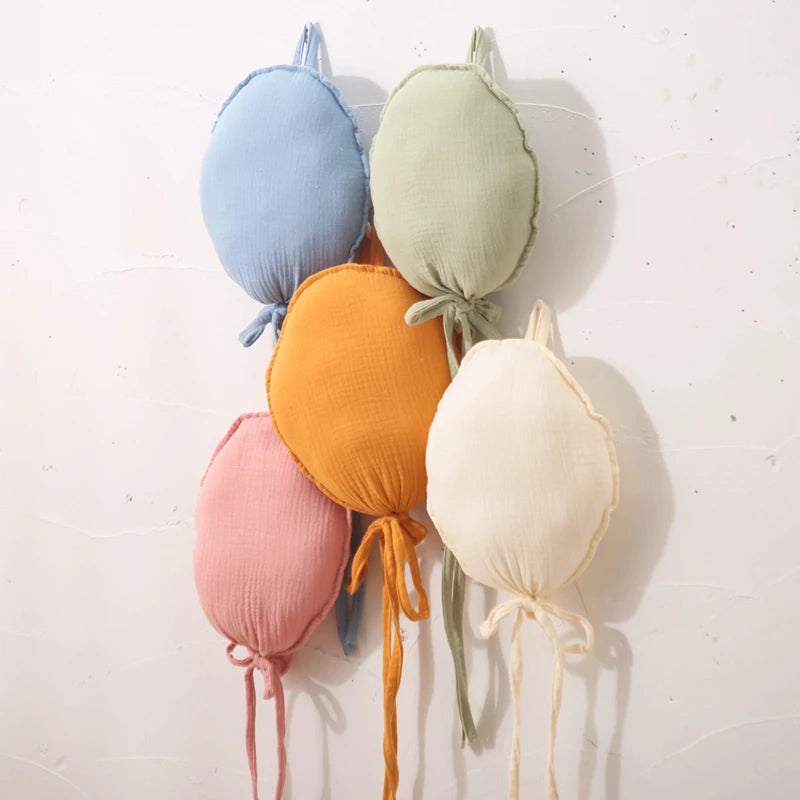 Add a touch of charm to your nursery with our Wall Hung Decorative Balloon Pillow. Perfect for all ages, this unisex pillow adds a whimsical touch to any room. Ideal for newborns, toddlers, and young children, it's a delightful and versatile décor piece for your baby’s space only at BubeBaby