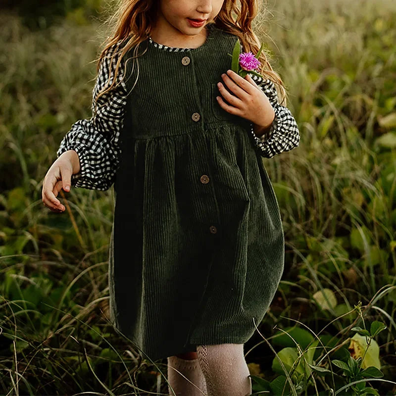 Discover the perfect autumn dress for your little one! This knee-length, A-line silhouette dress for ages 4-6 years features a solid pattern in polyester material. With a sleeveless, crew neck design and button decorations, it fits true to size. Ideal for stylish and comfortable wear