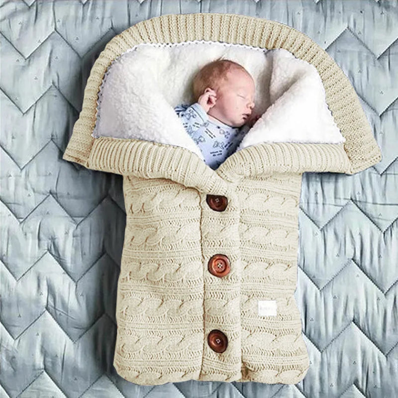 Nursery Knitted Sleeping Bag Cover at BubeBaby, designed for babies 0-12 months. Made from cozy wool and nylon, this unisex sleep sack is perfect for winter. Features include a solid pattern, knitted linen flower color, and measures 68x40 cm. Lightweight at 420g and packaged in a 40x32x3 cm box