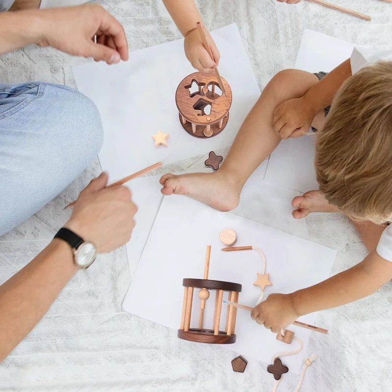 Introduce your child to learning with this Babylove Montessori Wooden Shape Matching and Threading Toy at Bubebaby. Suitable for ages 0-6, it boosts cognitive skills, hand-eye coordination, and pattern recognition. Made from non-toxic wood, free from harmful chemicals, it’s safe, durable, and perfect for educational play