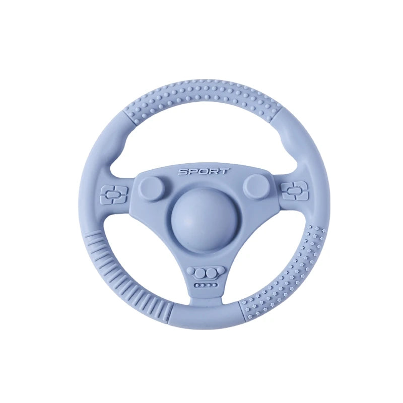 Silicone Bubebaby BabyLove Teething Toy Car Wheel – A fun and safe teether for babies, designed as an analog steering wheel. Made from 100% silicone, it's latex, nitrosamine, phthalate, BPA, and PVC free. Suitable for infants from 0 to 36 months. Available in various colors and comes in single packaging