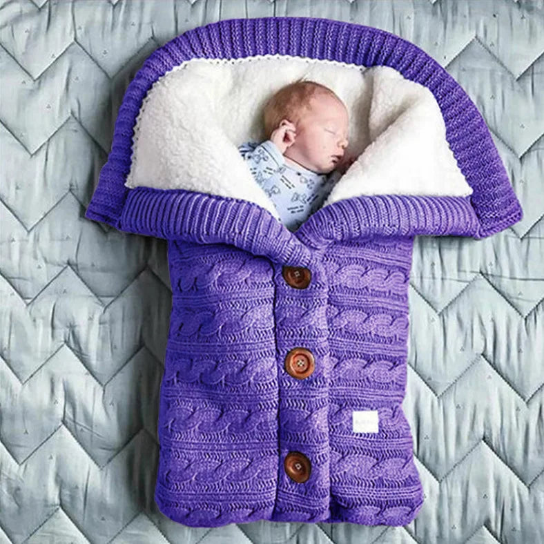 Nursery Knitted Sleeping Bag Cover at BubeBaby, designed for babies 0-12 months. Made from cozy wool and nylon, this unisex sleep sack is perfect for winter. Features include a solid pattern, knitted linen flower color, and measures 68x40 cm. Lightweight at 420g and packaged in a 40x32x3 cm box