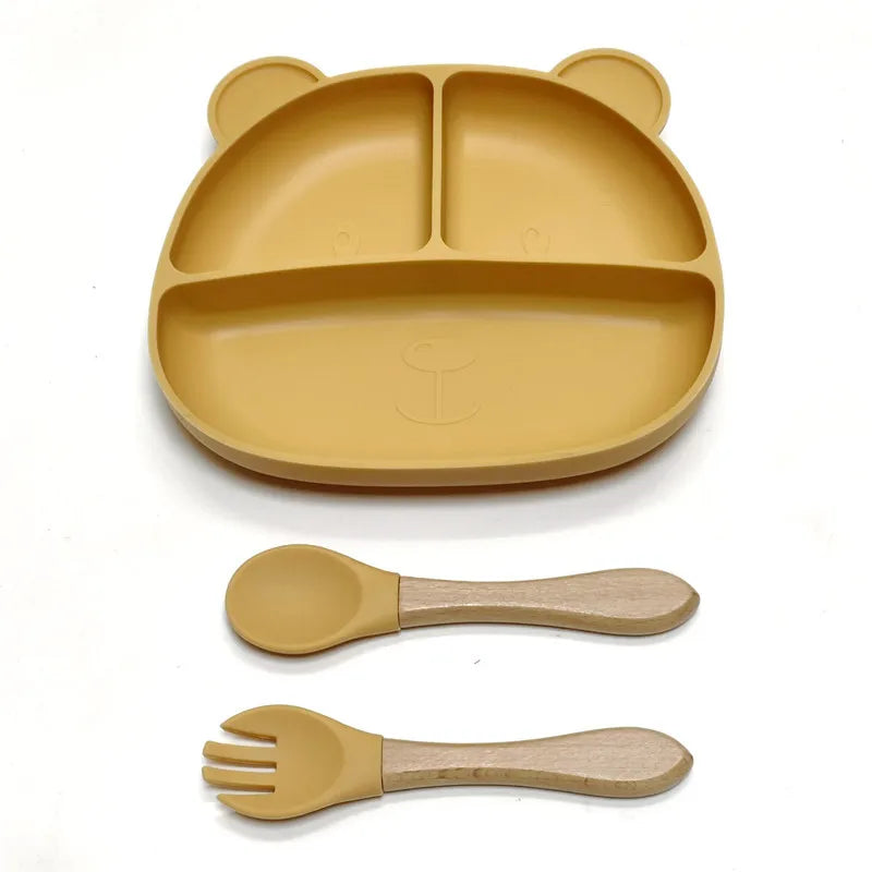 the BabyLove Silicone Dinner Plate with Cutlery at BubeBaby. Made from BPA-free silicone and CE certified, this dinnerware set is perfect for children aged 0-6 years. Featuring a solid pattern and multi-color options, it's designed for easy cleaning and safe feeding. Ideal for infants and toddlers