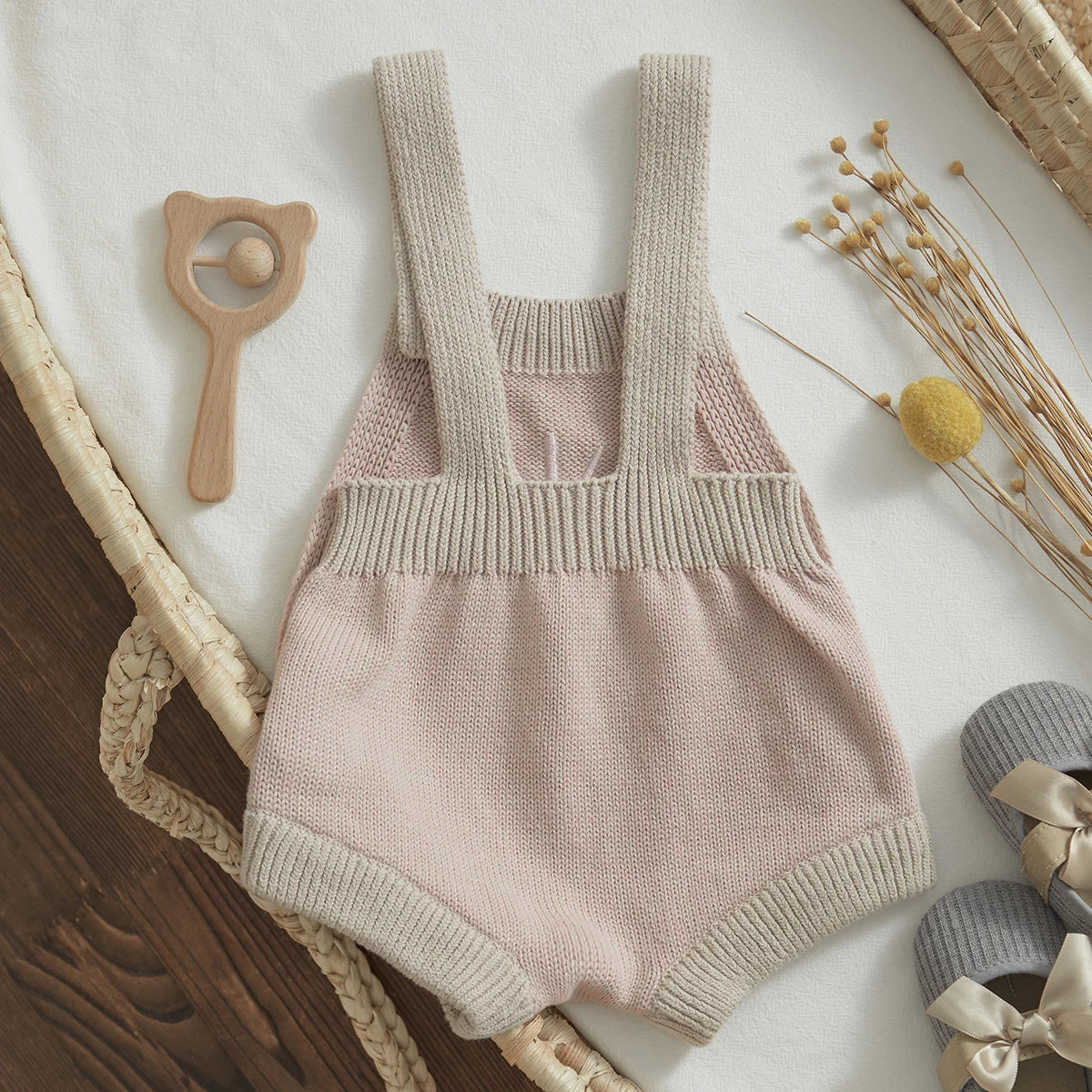  Baby unisex romper made from high-quality cotton and polyester, suitable for ages 0-24 months. The romper features a sleeveless design, straight collar, covered button closure, and a charming print pattern. Ideal for all seasons and available in various sizes to ensure a perfect fit.