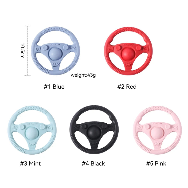 Silicone Bubebaby BabyLove Teething Toy Car Wheel – A fun and safe teether for babies, designed as an analog steering wheel. Made from 100% silicone, it's latex, nitrosamine, phthalate, BPA, and PVC free. Suitable for infants from 0 to 36 months. Available in various colors and comes in single packaging