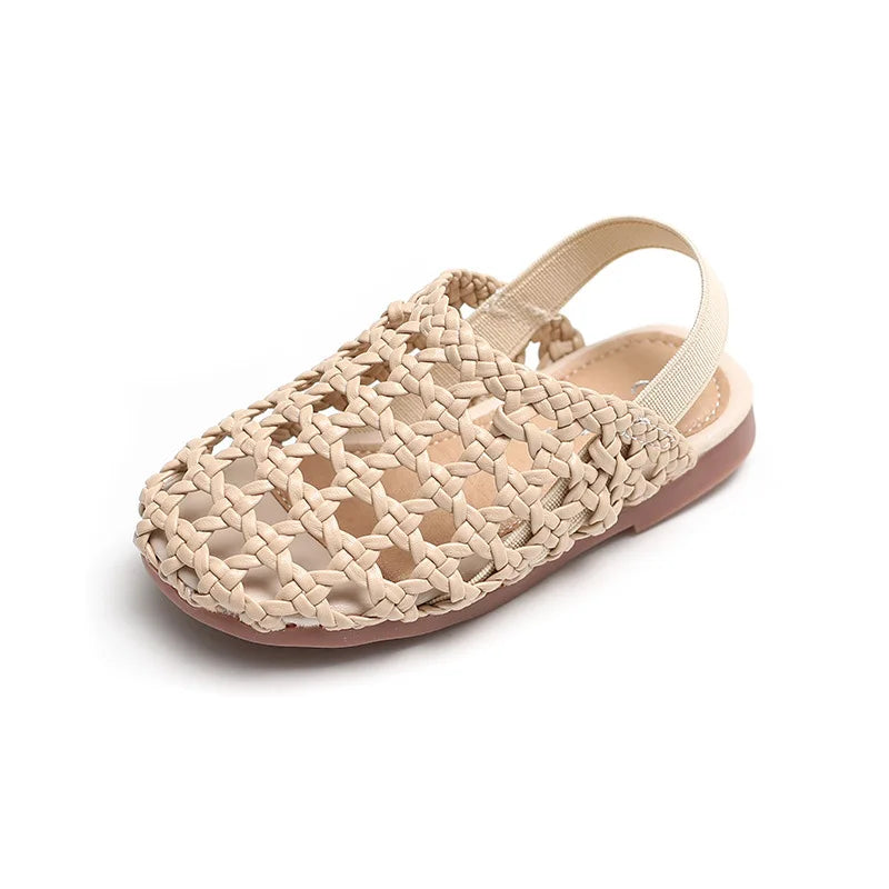 Shop BabyLove Woven Slip-On Sandals for girls at BubeBaby. These summer sandals feature soft faux leather, quick-dry fabric, and a flat heel with cut-out decorations. Available in sizes 15-25, they fit true to size and offer a comfortable, elastic band closure. Perfect for warm weather and stylish play