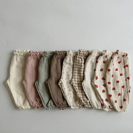 Soft muslin pants for babies from the BabyLove by Bubebaby collection. The pants are made of lightweight, breathable fabric with a gentle, stretchy waistband and a relaxed fit for comfort. The color is a soft, neutral tone, suitable for pairing with various baby tops