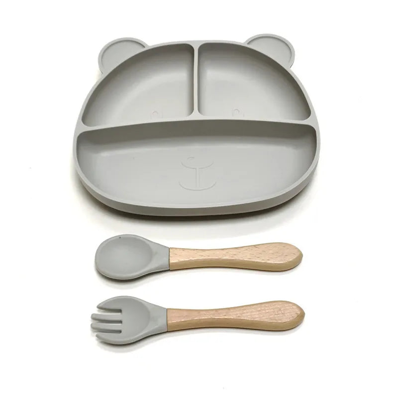 the BabyLove Silicone Dinner Plate with Cutlery at BubeBaby. Made from BPA-free silicone and CE certified, this dinnerware set is perfect for children aged 0-6 years. Featuring a solid pattern and multi-color options, it's designed for easy cleaning and safe feeding. Ideal for infants and toddlers