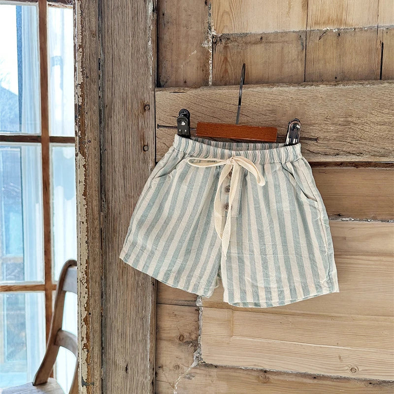 Shop our BabyLove Vintage Striped Shorts at BubeBaby. Perfect for summer, these unisex shorts feature a European and American style with a solid pattern. Made from soft cotton, they fit true to size and come in sizes ranging from 6-12m to 4-5T. Available in coffee, green, and beige. Ideal for ages 0-6 years