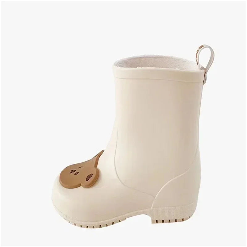 BabyLove Rain Boots at BubeBaby, Available in White, Pink, and Coffee, these waterproof PVC boots are perfect for kids aged 2-10. Featuring a cute pattern, breathable and non-slip design, and a true-to-size fit. Ideal for all seasons and keeping little feet dry on rainy days