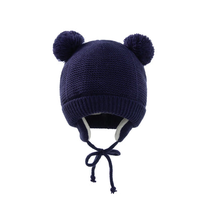 Shop the BabyLove Winter Knitted Bonnet at BubeBaby, perfect for keeping little ones warm in winter. Made from soft acrylic, this unisex bonnet features a solid pattern and ear protection design