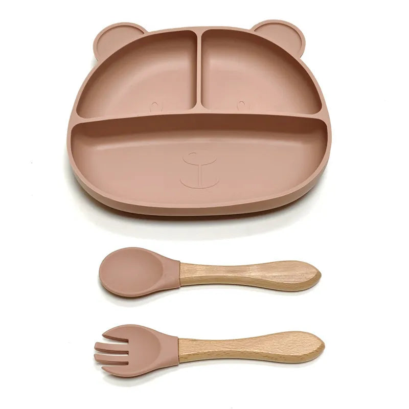 the BabyLove Silicone Dinner Plate with Cutlery at BubeBaby. Made from BPA-free silicone and CE certified, this dinnerware set is perfect for children aged 0-6 years. Featuring a solid pattern and multi-color options, it's designed for easy cleaning and safe feeding. Ideal for infants and toddlers