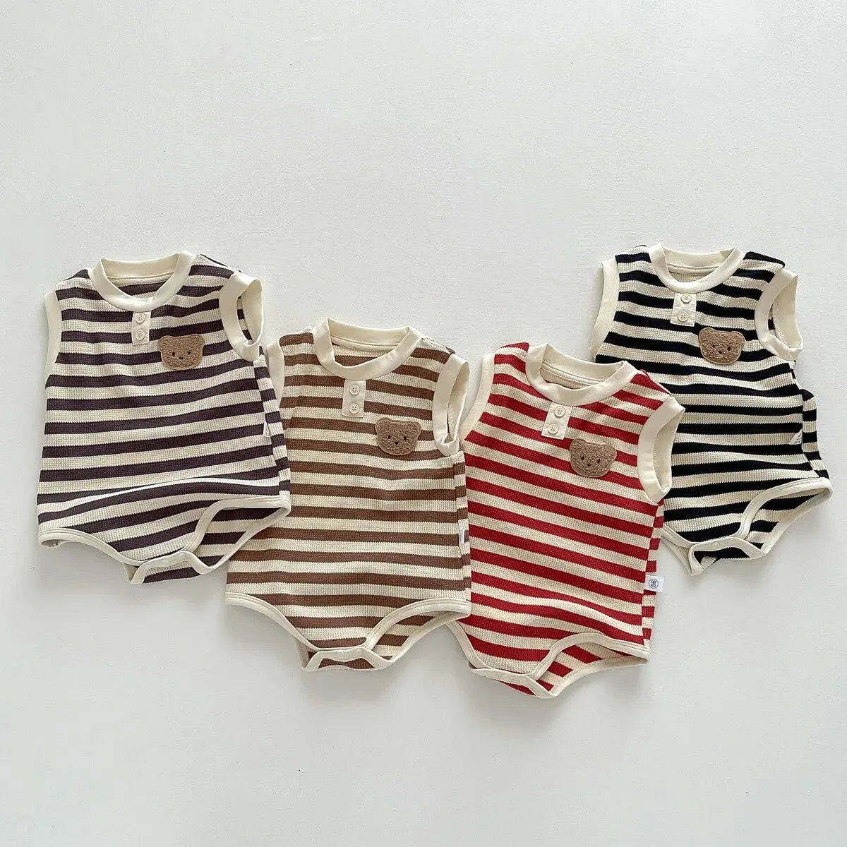 Keep your baby stylish and comfy with our BabyLove Striped Summer Sleeveless Romper From Bubebaby. Made from 95% cotton, this pullover romper features a breathable, sleeveless design perfect for hot days. Available in sizes for 0-24 months, it's ideal for keeping little ones cool and free to explore. Shop now for the perfect summer outfit