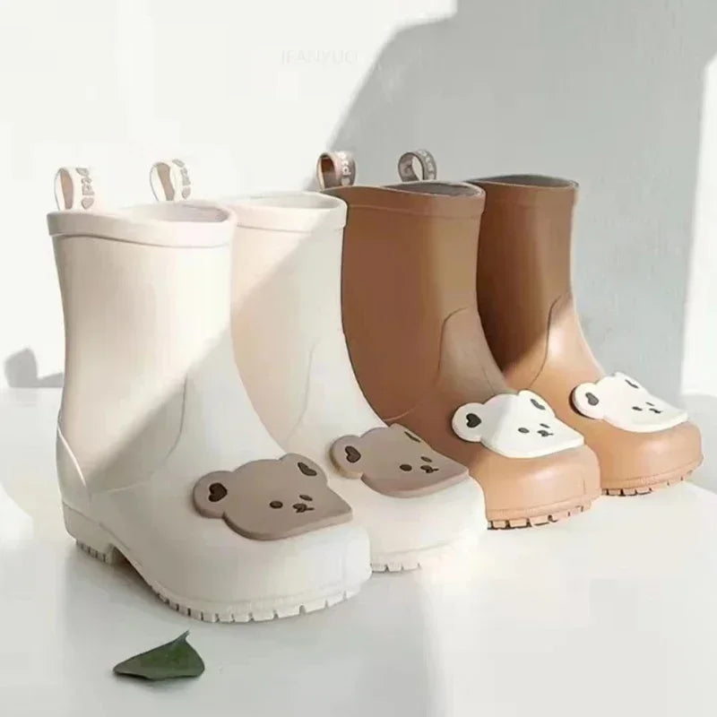 BabyLove Rain Boots at BubeBaby, Available in White, Pink, and Coffee, these waterproof PVC boots are perfect for kids aged 2-10. Featuring a cute pattern, breathable and non-slip design, and a true-to-size fit. Ideal for all seasons and keeping little feet dry on rainy days